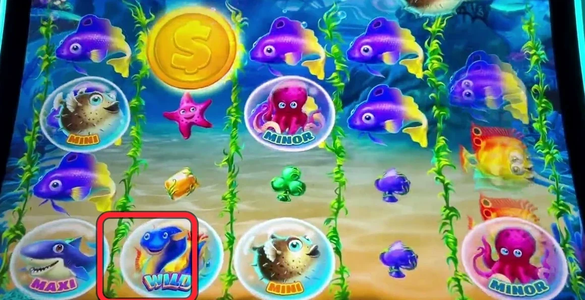 The read in one glance: the red ring is on the only WILD bubble on this board — down in the bottom row, climbing toward the yellow coin. Everything else (MINI, MAXI, MINOR jackpot bubbles) is noise. One wild is not enough; you count WILDs and need three below the top row.