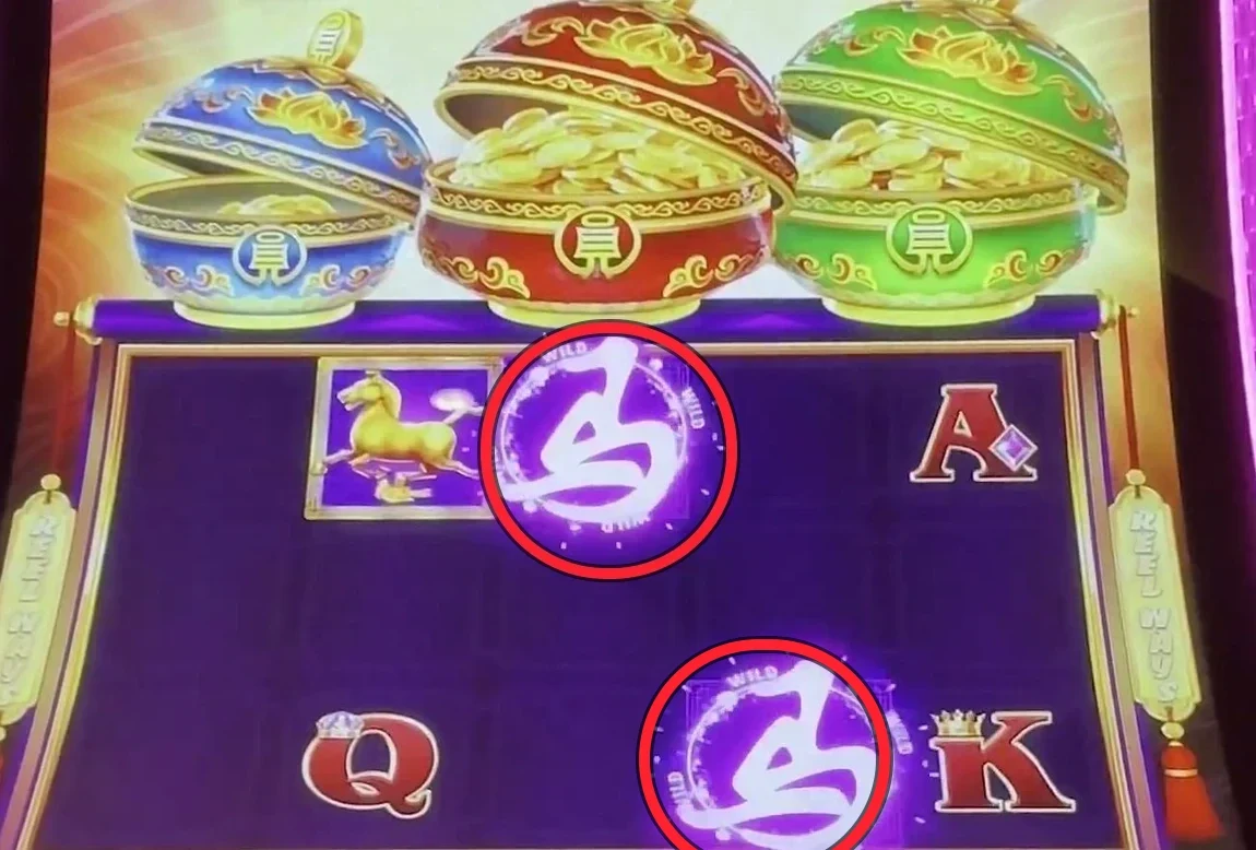 Two glowing purple WILD symbols stacked in the center reel — the cleanest version of the play. Count only reels 3, 4 and 5, and ignore anything sitting on the very top row, since it slides off next spin.