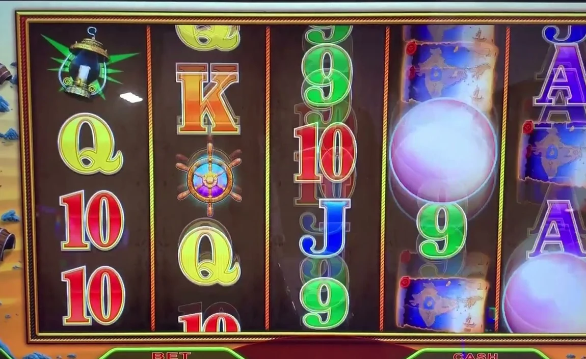 Two white pearl scatters on screen at once — one sitting mid-reel (not the bottom row) and one lower on the next reel. Two pearls with at least one off the bottom row is the play: those pearls are persistent and step down a row next spin, so a third can complete the free-games trigger.