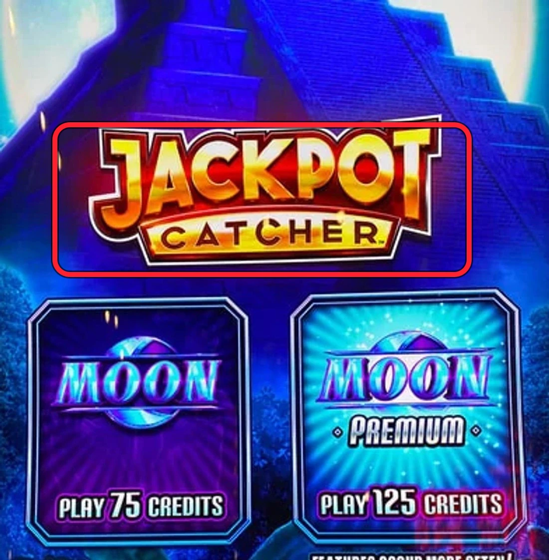 Ringed: the gold JACKPOT CATCHER wordmark on the glass, with the radiant blue Moon key symbol below (the Sun/Moon pair the game is built on). Confirm both before you sit — that's how you know you're at the right machine.