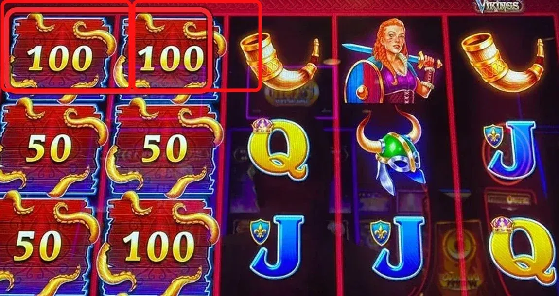 Two wood panels in the top row (red-ringed: 100 and 100 on reels 1 and 2) - this is the play. Four more panels are stacked below them on the same reels, meaning new panels just entered at the top and are sliding down one position every spin. You need six total to start the feature, and a loaded top row is your sit-down signal.