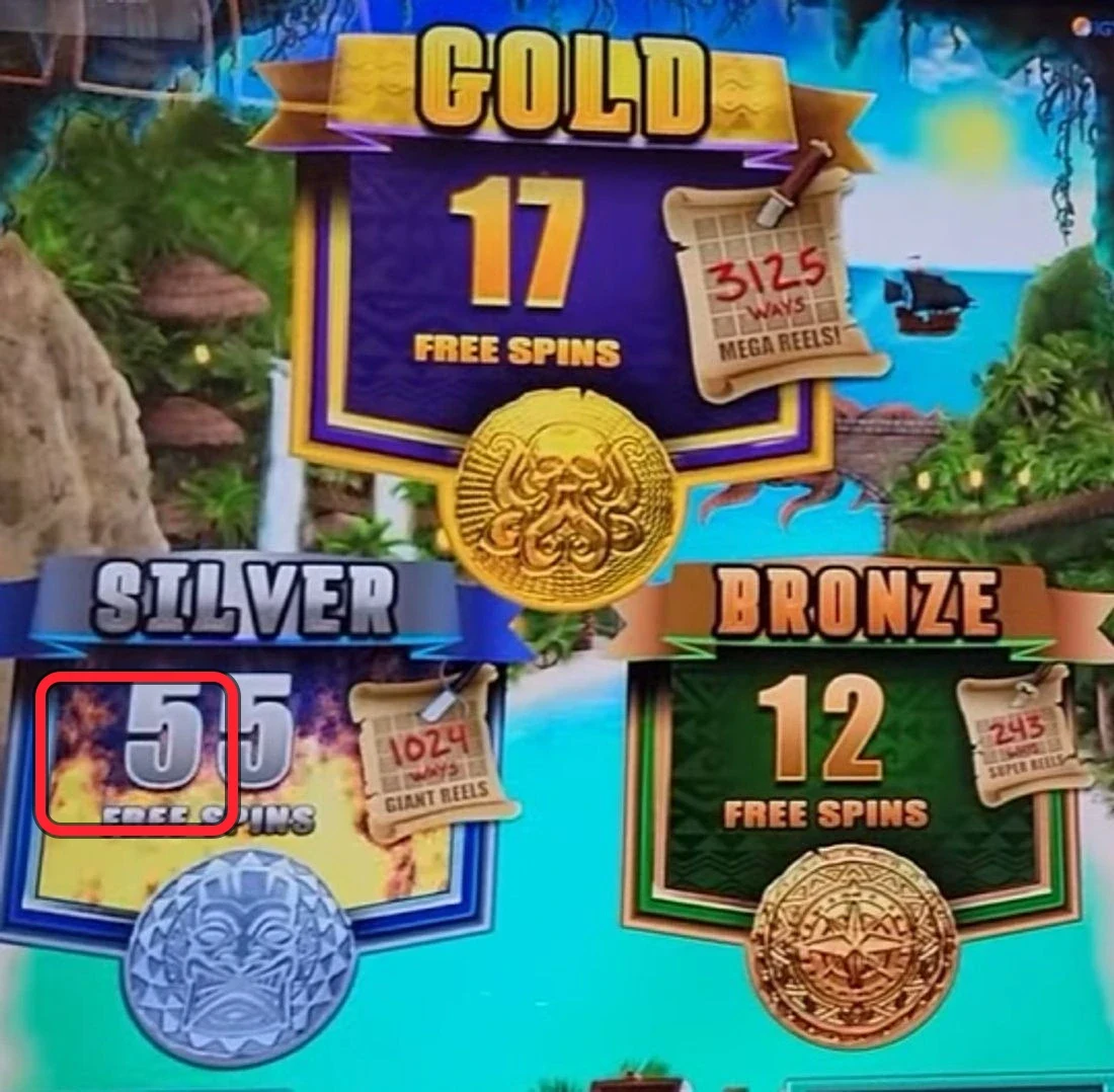 Where to read it: all three free-games counters stacked on one screen — ringed is GOLD (36 free spins / 3125 ways), with SILVER (16 free spins / 1024 ways) and BRONZE (10 free spins / 243 ways) below. Read these three counts off the bet pad before you insert money. Your play lines are Gold 100+, Silver 50+, Bronze 40+ free games; this particular read sits below all three, so it's a walk — wait for a counter to climb to its line.