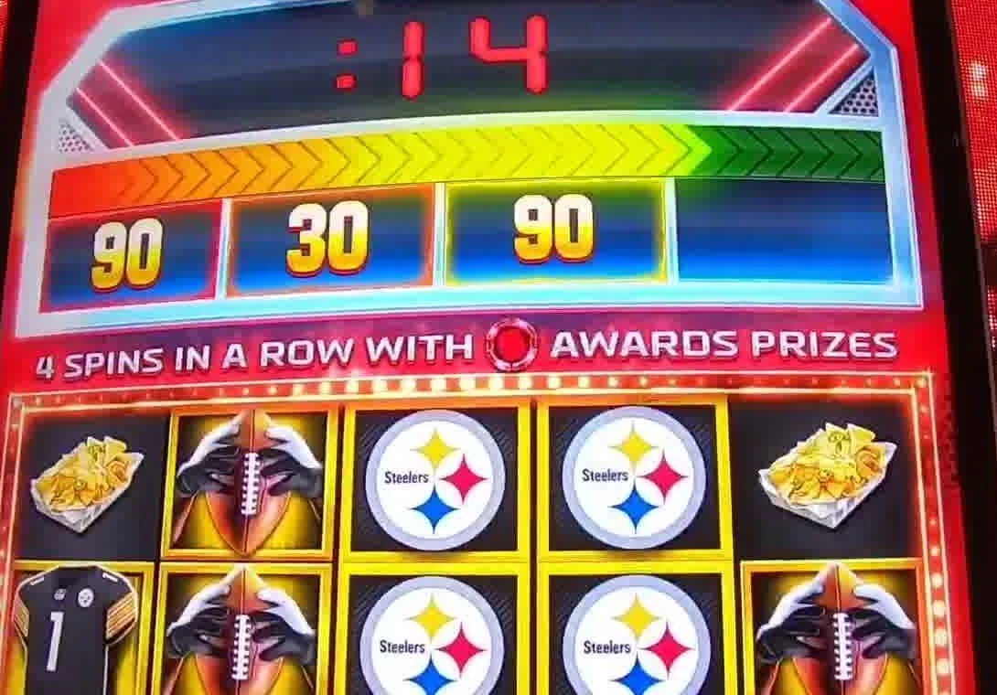 The read in one glance during a live 2-Minute Drill: the countdown timer running, the chevron bar climbing, and prizes already sitting in the boxes above the reels — 90, 30, 90. One or more prizes collected with the drill still going is the play.