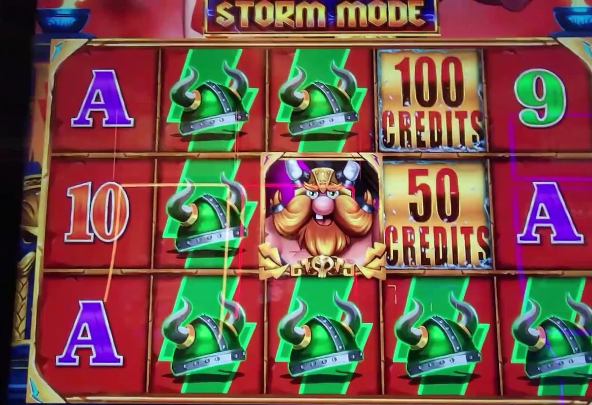 The same signal confirmed in-game: the gold STORM MODE banner lit above the reels and the Thor symbol sitting in the center position, awarding the 100 CREDITS and 50 CREDITS prize panels showing on the other reels. Any time Storm Mode is running like this, it is a play.
