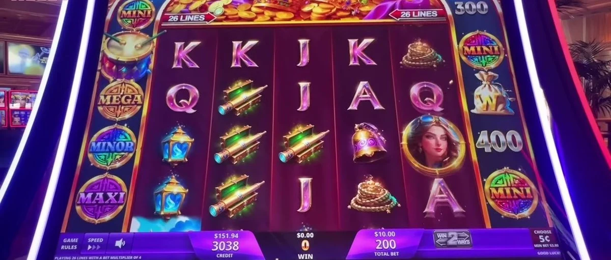 The whole read in one frame: the outer rim of prizes (1500 / 600 / x2 / 900 on the left, 300 / 300 on the right) and the jackpot ladder around it — GRAND, MINI, MAJOR, MINOR. Scan this rim before you sit.