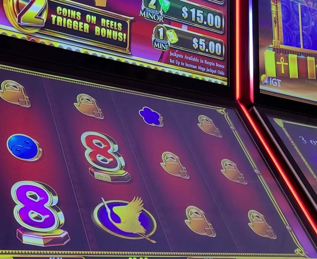 The persistent counter reads '2 COINS ON REELS TRIGGER BONUS' — a previous player drove it down from the default 6, so the Respin Bonus now fires on just 2 coins instead of 6. Two or fewer is a very strong sit. That counter is the whole play; everything on the reels is secondary.